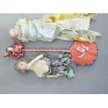 A 1920's china and plaster half doll impressed HEDDA to back, a bisque headed baby doll-needle