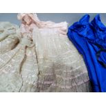 A Victorian pink silk and ecru lace flounced petticoat and a royal blue petticoat, a maids