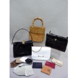 A tan suede hand bag with bamboo hoop handle together with a white 'patent' bag with chain a black