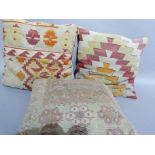 Three kilim cushions in camel, orange and red (2) and rose and camel, plain backs, 48cm squared