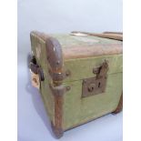 A canvas trunk with wood ribbing with luggage labels 'Luggage in Advance' 85cm wide x 52cm deep x