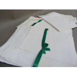 A set of six white linen hemstitch pillow cases and two under pillow cases