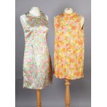 Two floral print mini dresses circa 1960's, and a navy blue/yellow/green/red print maxi, size 8