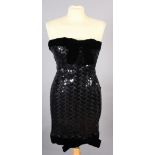 A Victor Costa strapless black sequin and net cocktail dress with velvet bow detail to the neck