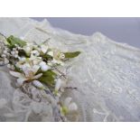 A 1920's cream satin and lace wedding veil with wax flower headband