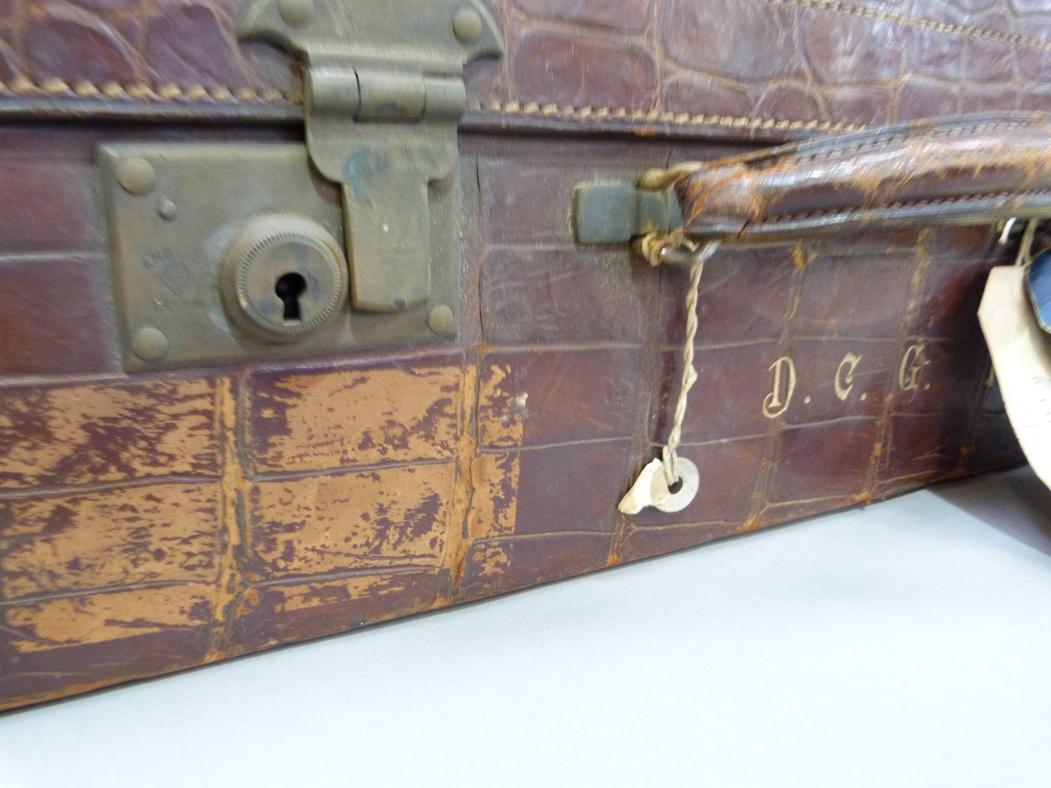 An early 20th century crocodile skin suitcase by Arthur Barber of Bradford, the interior lined in - Image 2 of 3