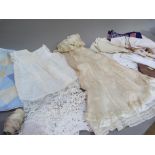 A pair of Brettle's rayon stockings, as new together with a christening gown and infants dress and a