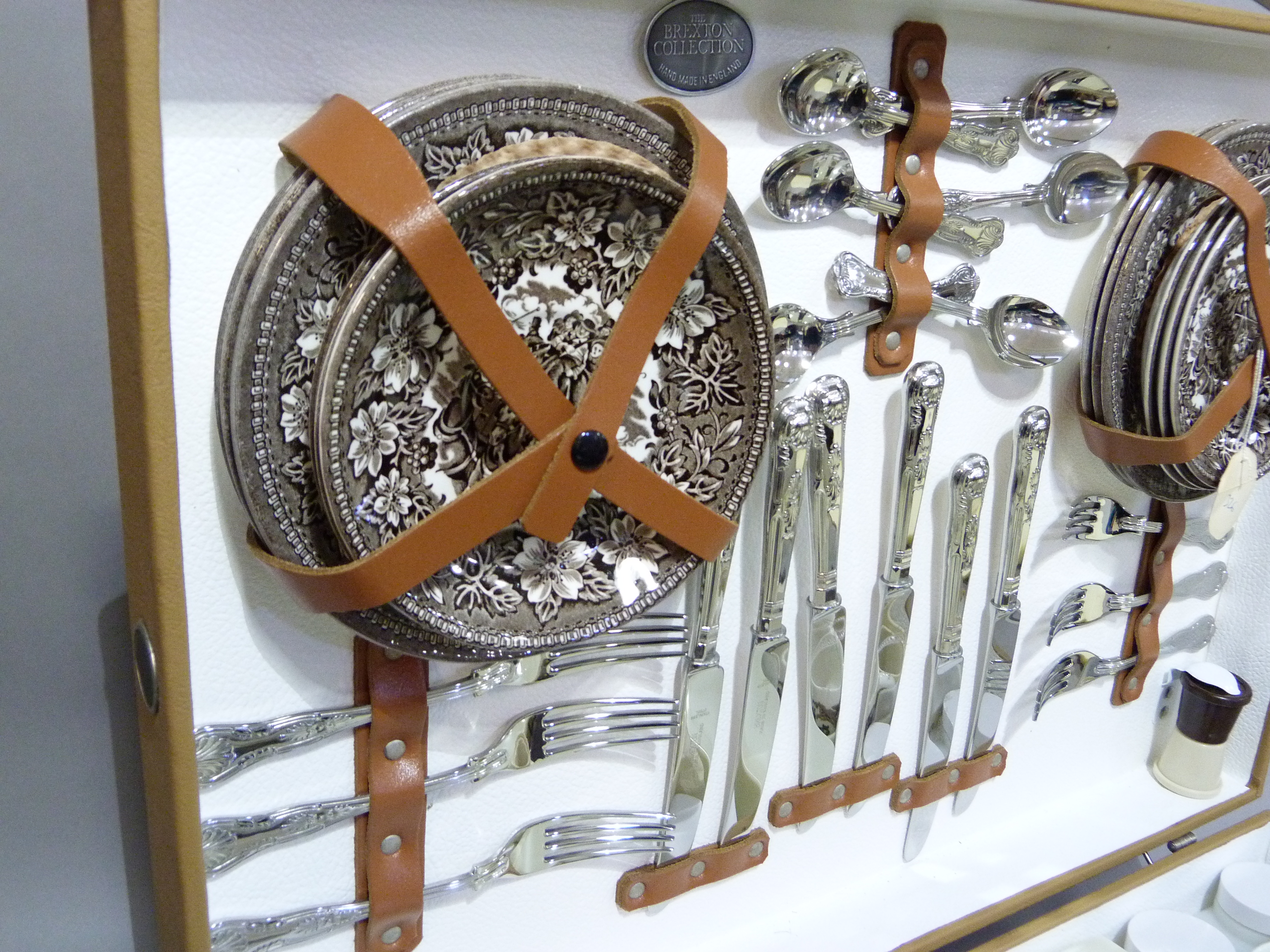 A vintage picnic hamper by Brexton Collection fitted for six, comprising: six pottery cups,