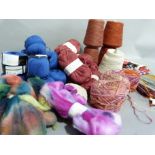 A large quantity of knitting needles, wools and yarns including three balls of organic merino and
