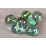 Seven large vintage marbles, Cats Eye type, 2.4cm diameter