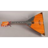 A Russian three string Balalaikal, 67cm long