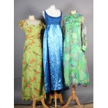 A lined chiffon full length shirt dress in shades of green and purple; a blue satin full length