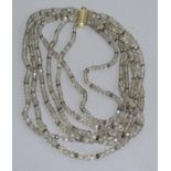 A multi strand necklace of graduated facetted smoky quartz beads with rolled gold fittings,