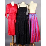 A Radley black lined full length chiffon evening dress with shoe string ties, size 14, and a red