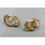 A pair of knot earrings in 18ct gold on post fittings (scrolls absent), approx 3gm
