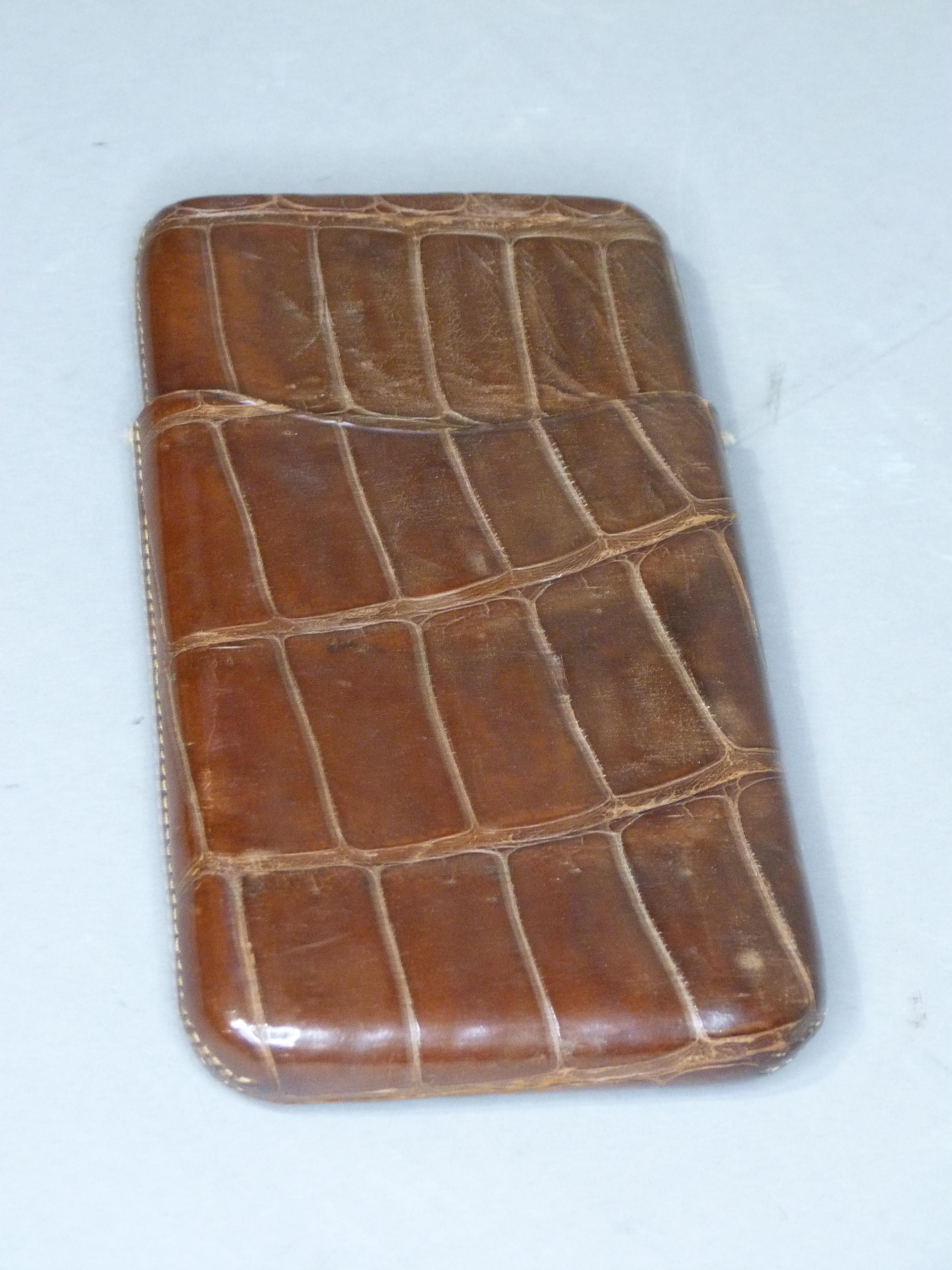 A crocodile skin cigar case