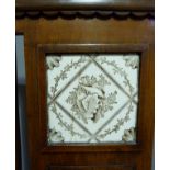 A Victorian walnut hall chair with foliate carved cresting the rectangular back inset transfer