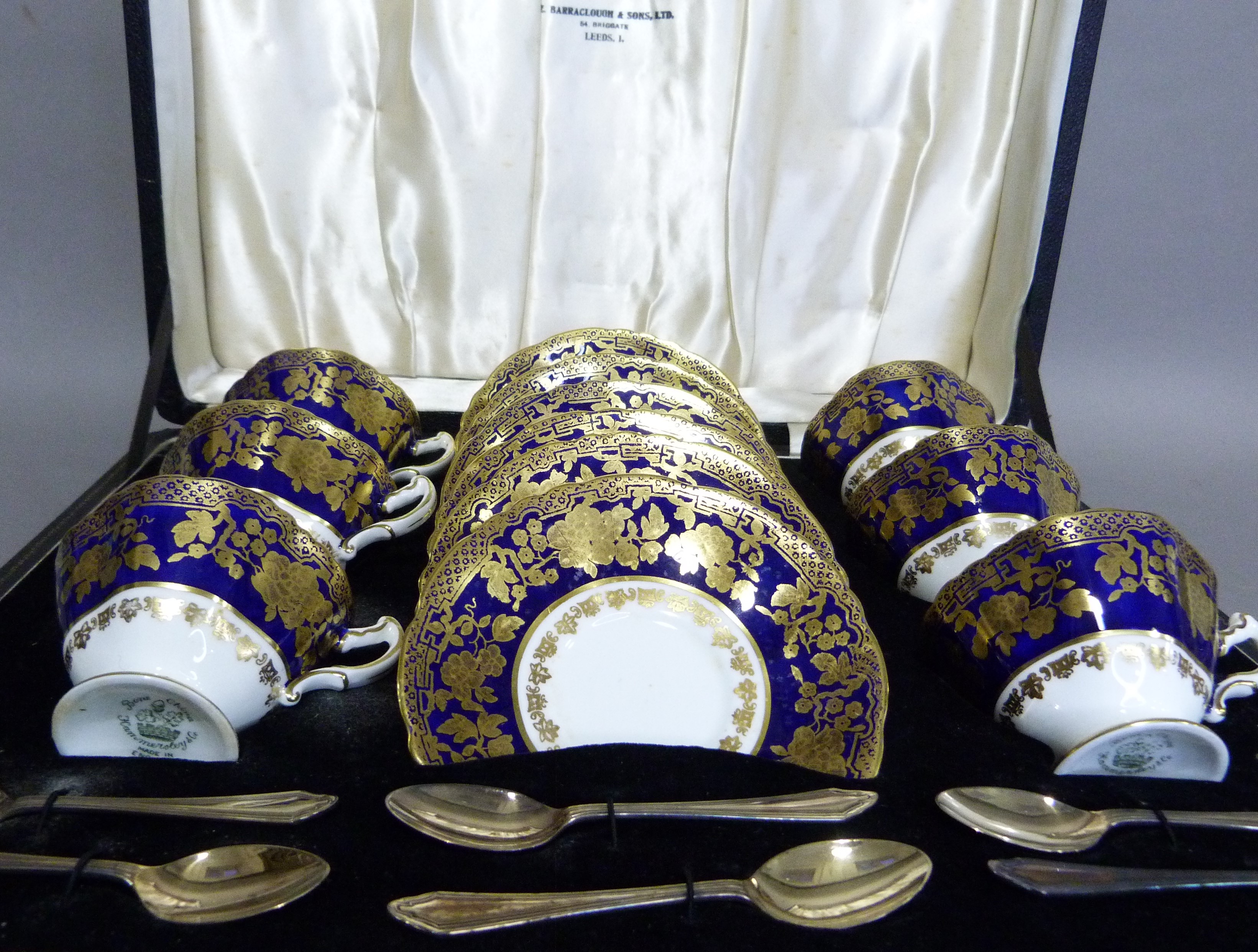 A set of six Hammersley china tea cups and saucers decorated in dark blue and gilt on a white