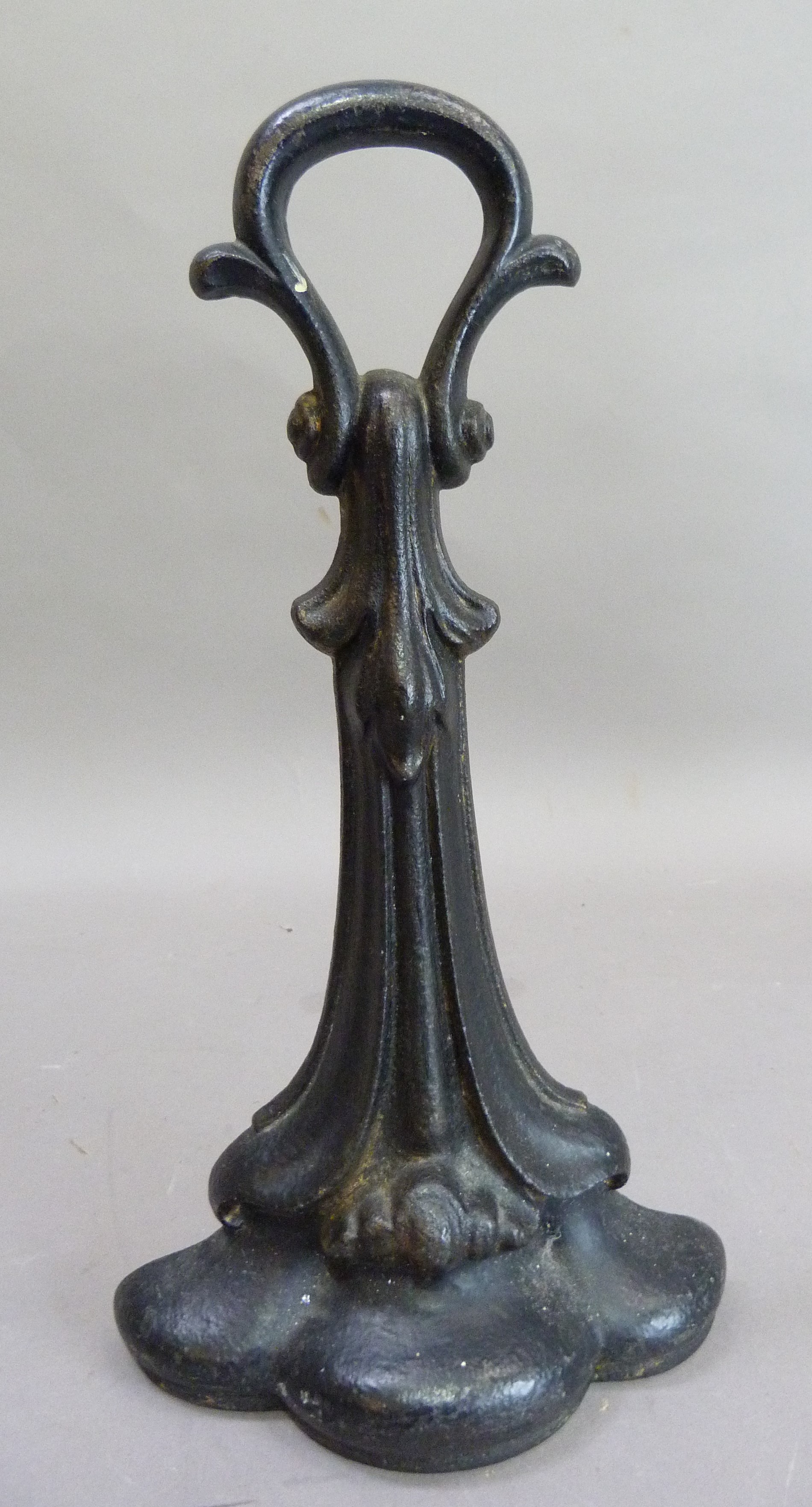 A Victorian cast iron door porter with loop handle and of leaf form, 32cm high - Image 2 of 2
