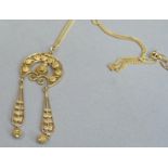 A filigree pendant in yellow metal (tests as 18ct gold) hung on a fine cut link chain of yellow