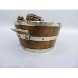 An Edwardian oak and silver plated planter of barrel form with twin handles, 23.5cm x 13cm