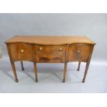 A reproduction mahogany serpentine fronted sideboard in George III style the top with cross