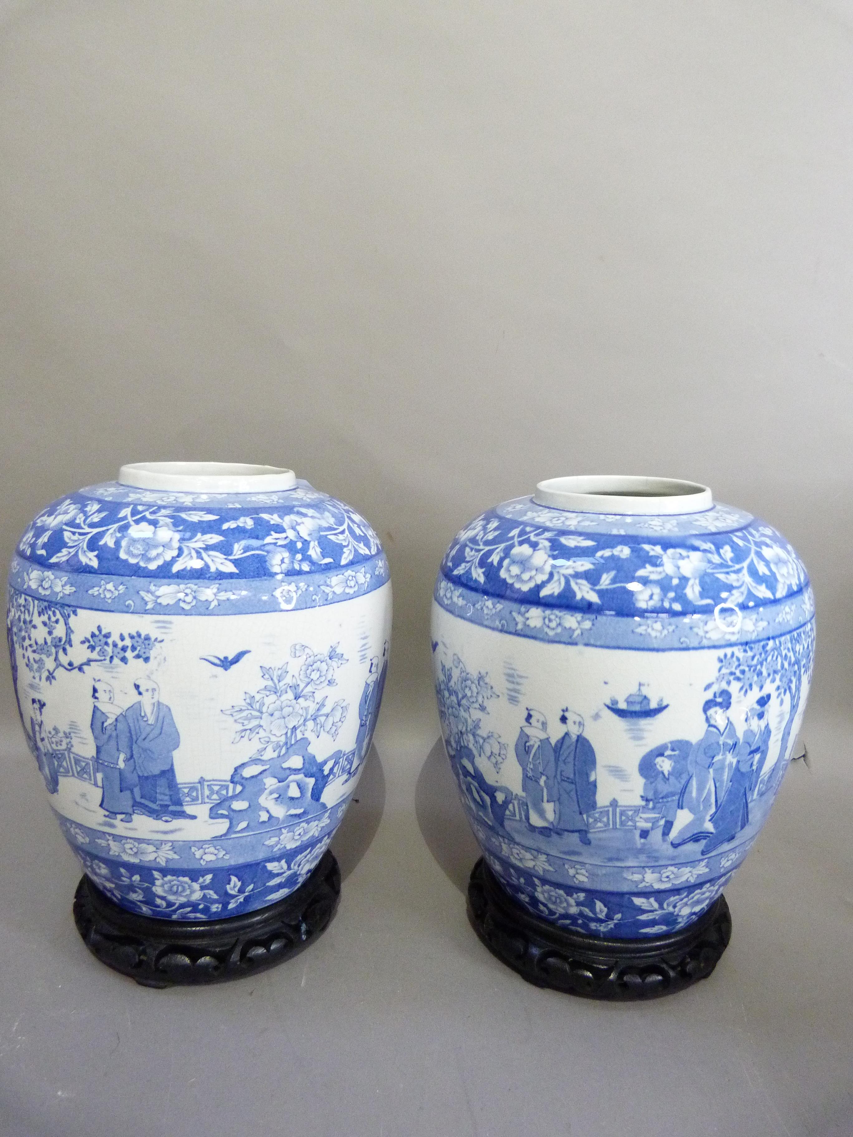 A pair of EPC, Stoke-on-Trent pottery ginger jars, decorated in underglaze blue with chinoiserie