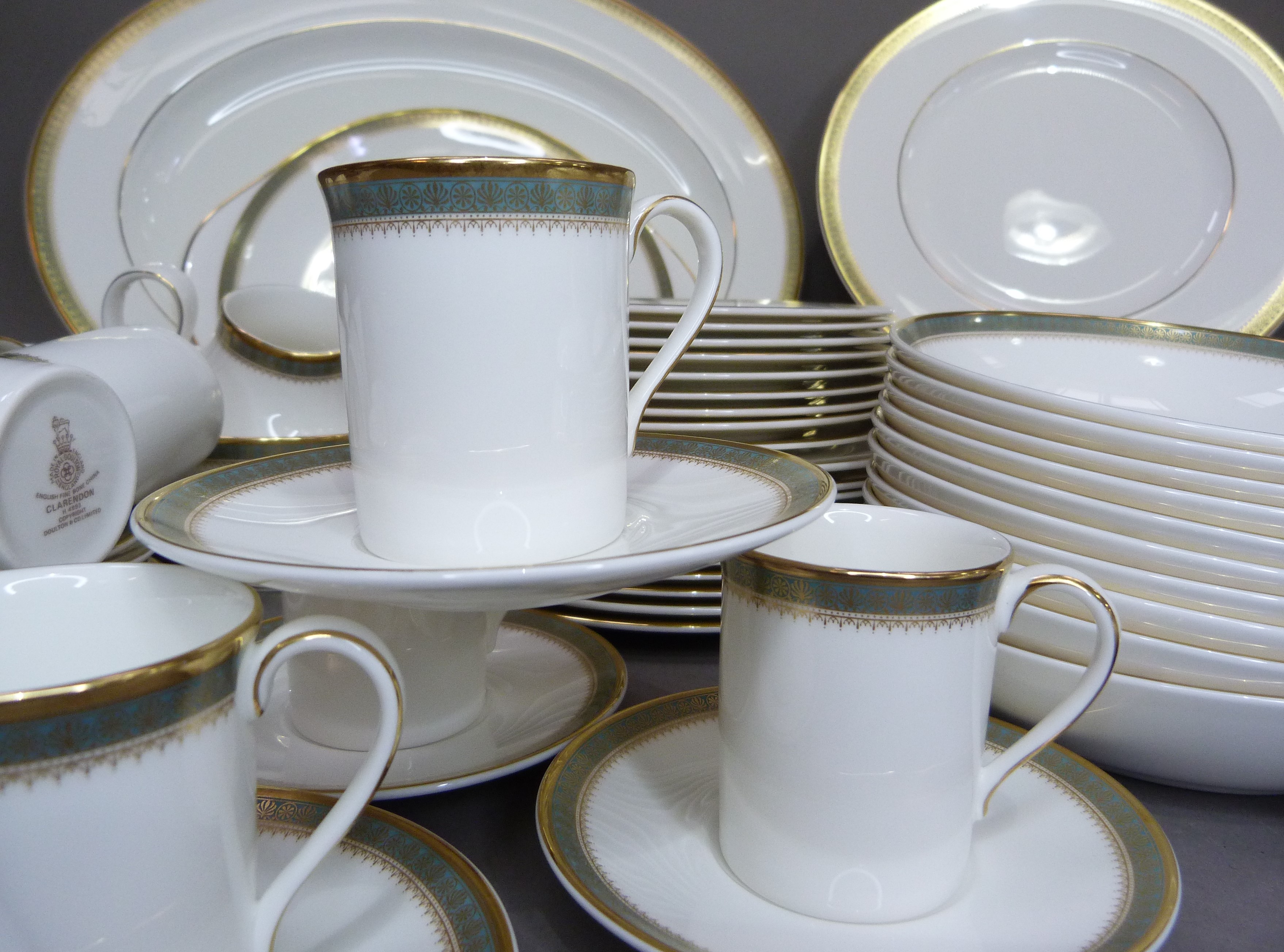 A Royal Doulton Clarendon china dinner service with white ground border in blue and gilt - Image 2 of 3