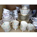 A quantity of rosebud decorated dinner and tea ware, an art deco part service, a Tuscan china gilt