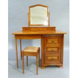 A cherry wood dressing table having an arch shaped bevel mirror on a semi bow front three drawer