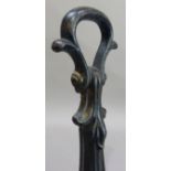 A Victorian cast iron door porter with loop handle and of leaf form, 32cm high