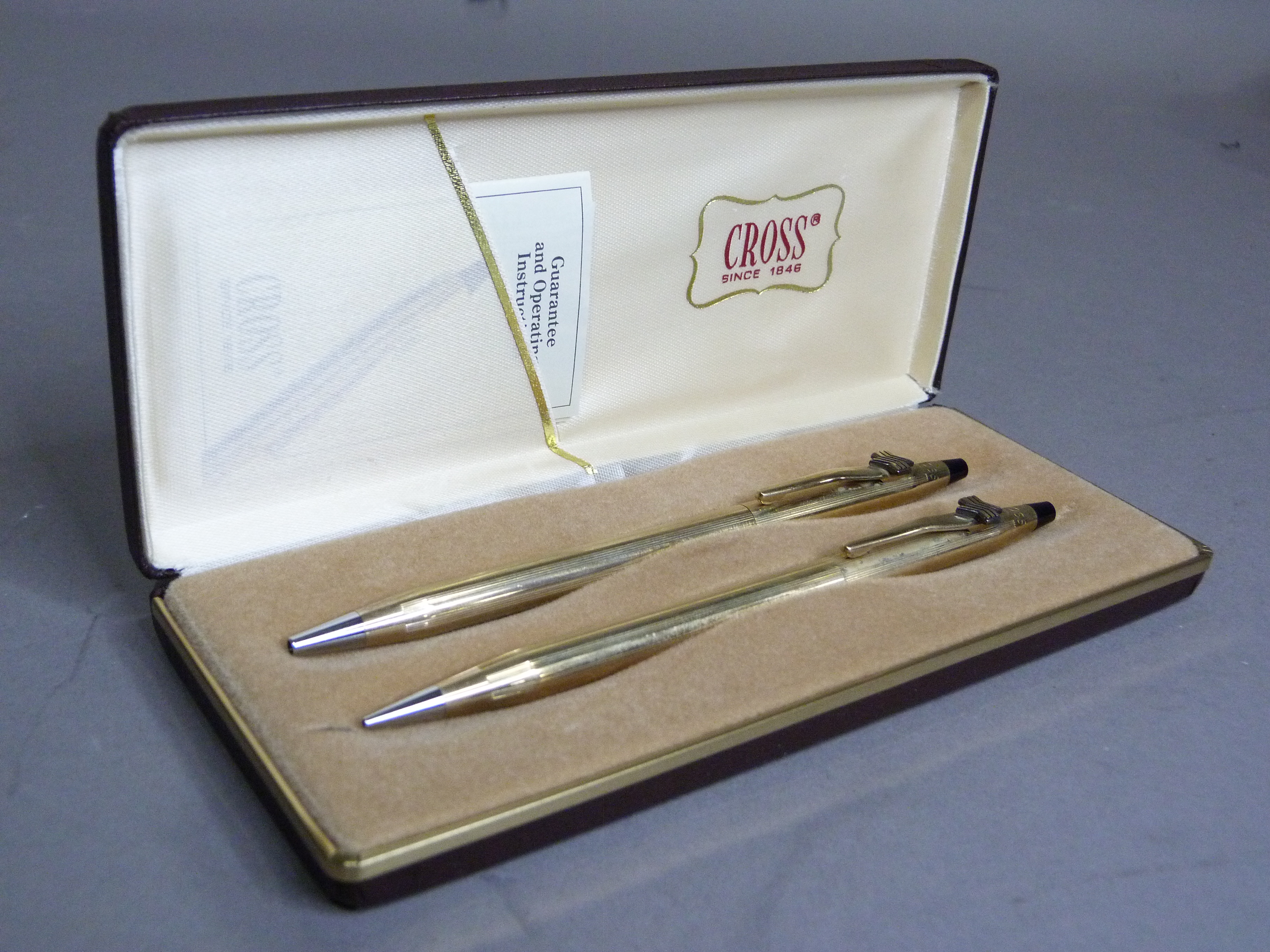 A gilt metal Cross ball point pen and retractable pencil in original box