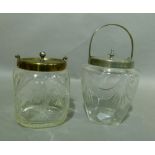 Two Edwardian glass biscuit barrels, the first of square dimpled form, cut and etched with
