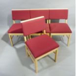 A set of four beech framed single chairs upholstered in crimson to the back and seats, each with