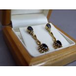 A pair of sapphire and diamond cluster ear pendants each set with oval facetted sapphires and