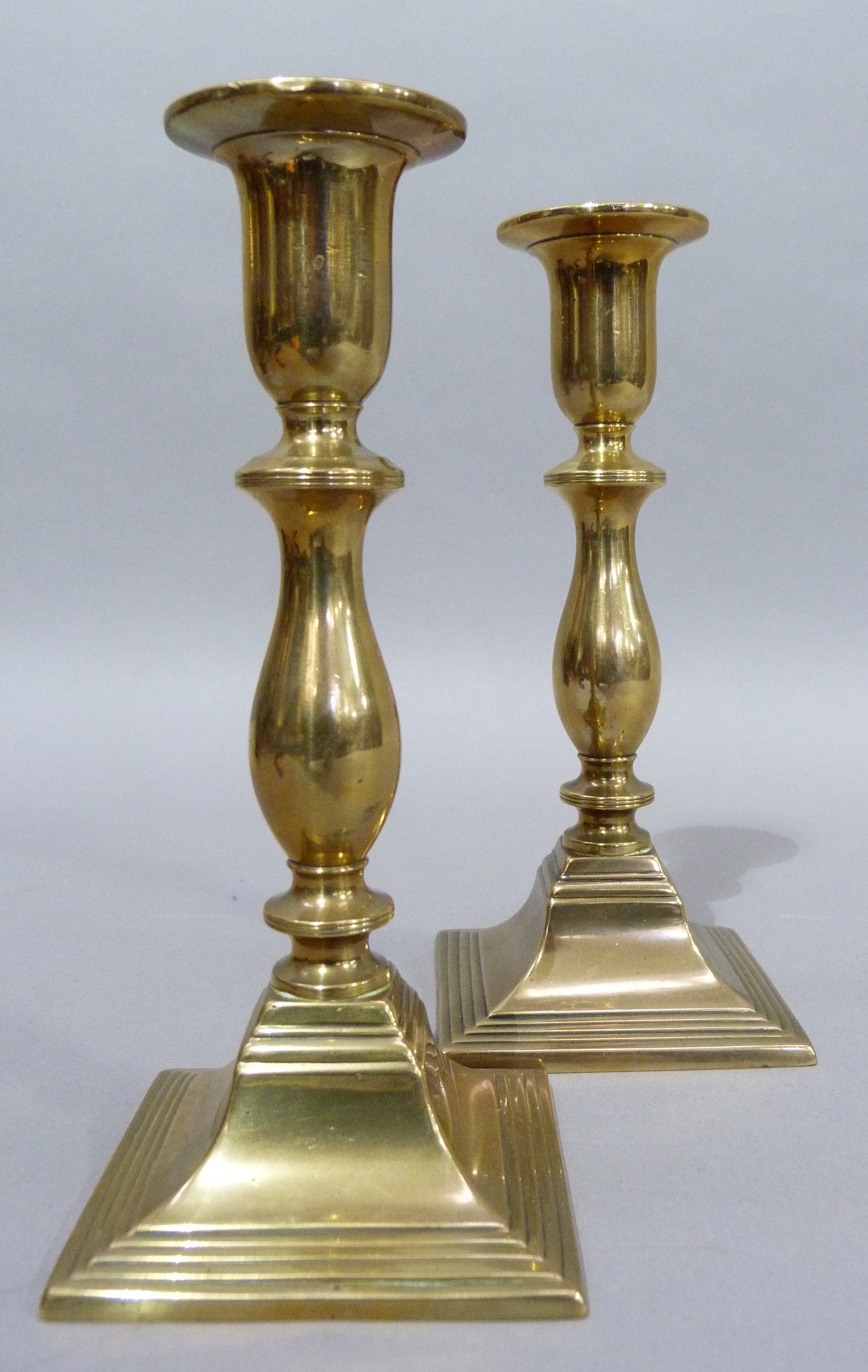 A pair of nineteenth century brass candlesticks of baluster outline on square stepped bases, 19cm - Image 2 of 4