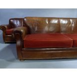 An Edwardian style three seater sofa and matching two seater sofa upholstered in chestnut hide