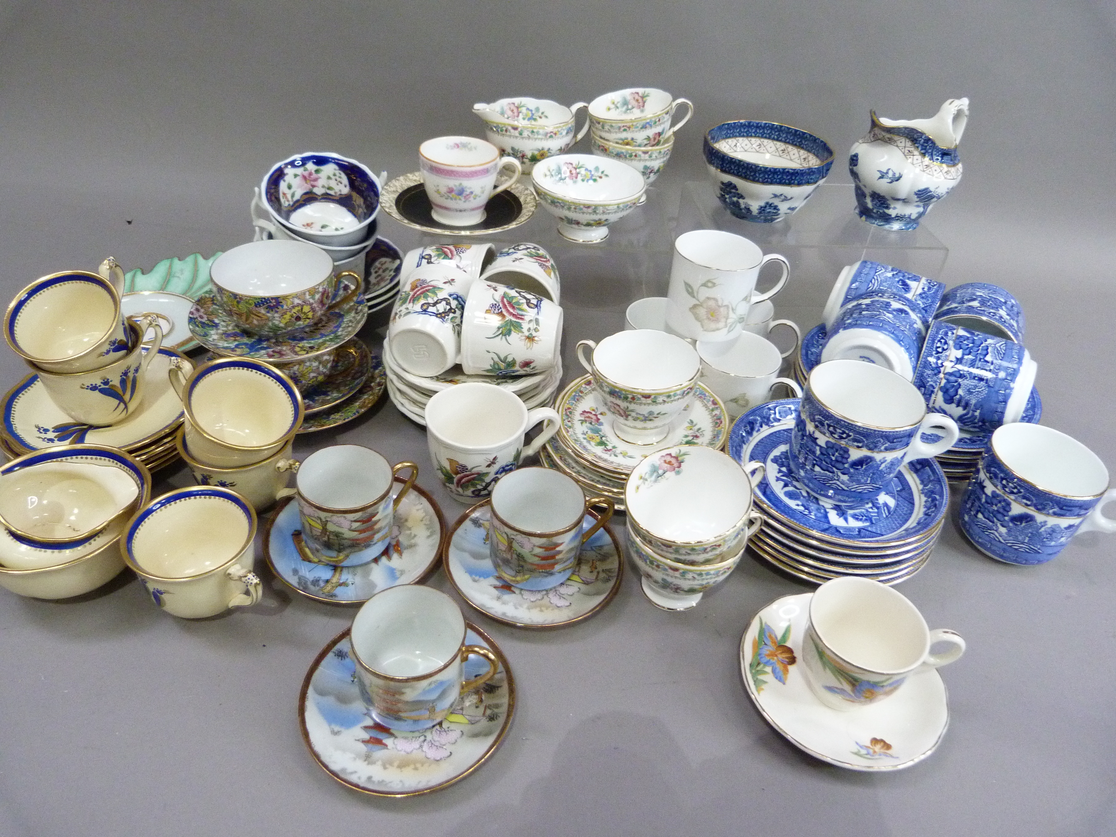 A Sutherland china, blue and white willow pattern tea service of six cups, six saucers, six tea