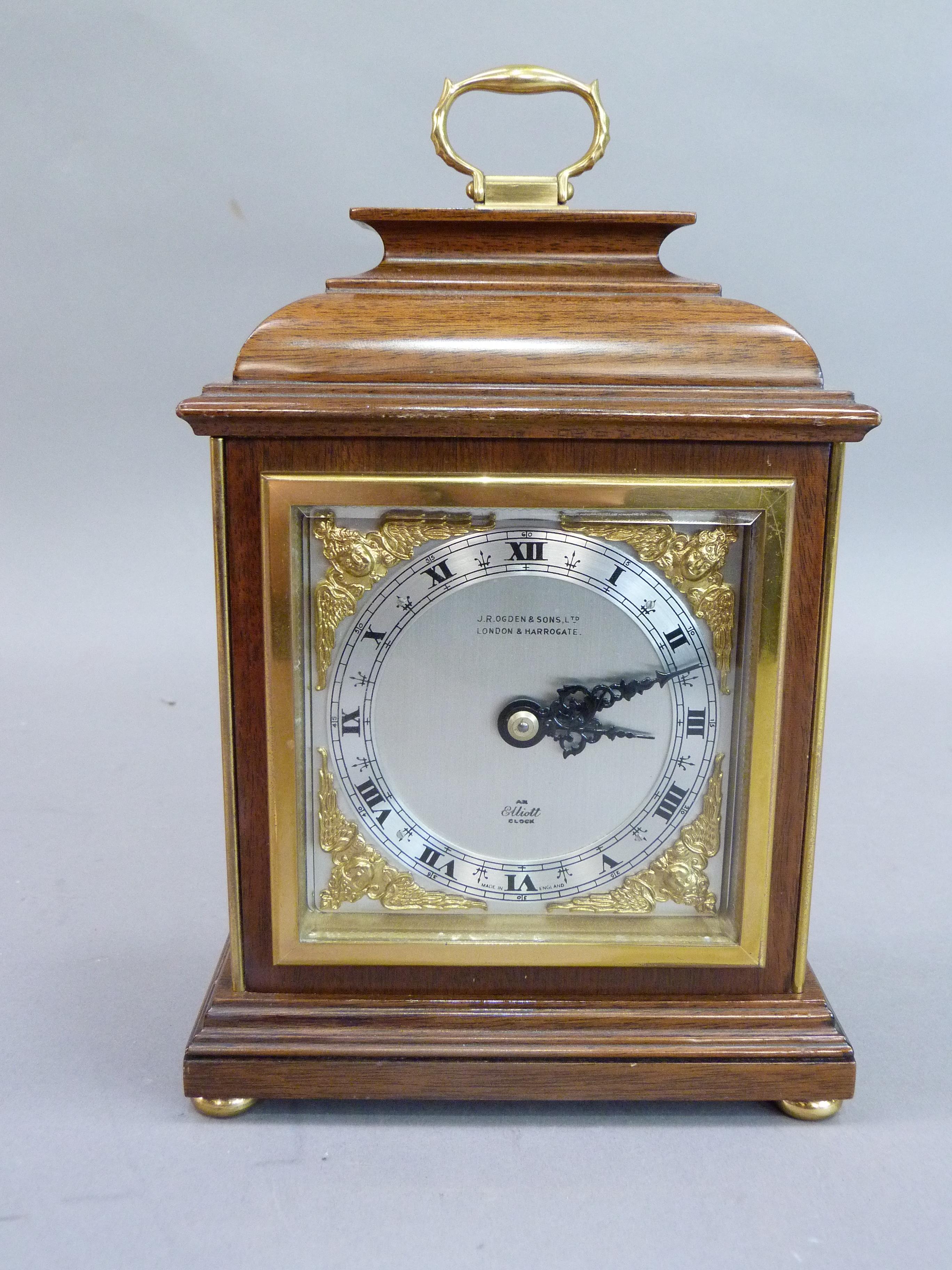 Late twentieth century mahogany bracket style mantel clock by Elliot having a silvered dial, chapter