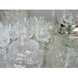 A quantity of cut and plain glassware including harlequin hocks, cut glass rose bowl, vases etc