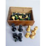 A Staunton style small chess set, ebonized and boxwood contained within a mahogany box with