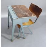 A childs aluminum painted school desk, the top with folding lid above well on square tapered legs;