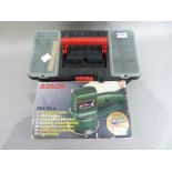 A Bosch pex115a circular sander; together with a McKeller 850w angle grinder, in Tough Stuff tool