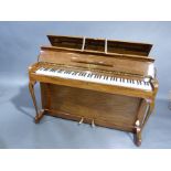 A Kemble minx miniature piano, walnut framed with overstrung, overdamped movement bearing a label