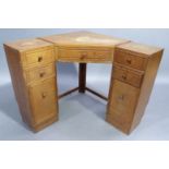 An oak corner desk, with one long drawer above the kneehole centre, flanked by pairs of two short