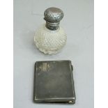 A George V silver cigarette case of engine turned decoration, Birmingham 1933, together with a