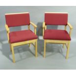 A pair of beech framed reception chairs upholstered in bright blue fabric