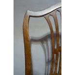 A mahogany dining chair in Hepplewhite style with pierced waisted splat and serpentine shaped top