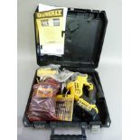 A DeWalt XRLI- iondcs331 cordless jigsaw with ten blades, charger and additional power pack, cased