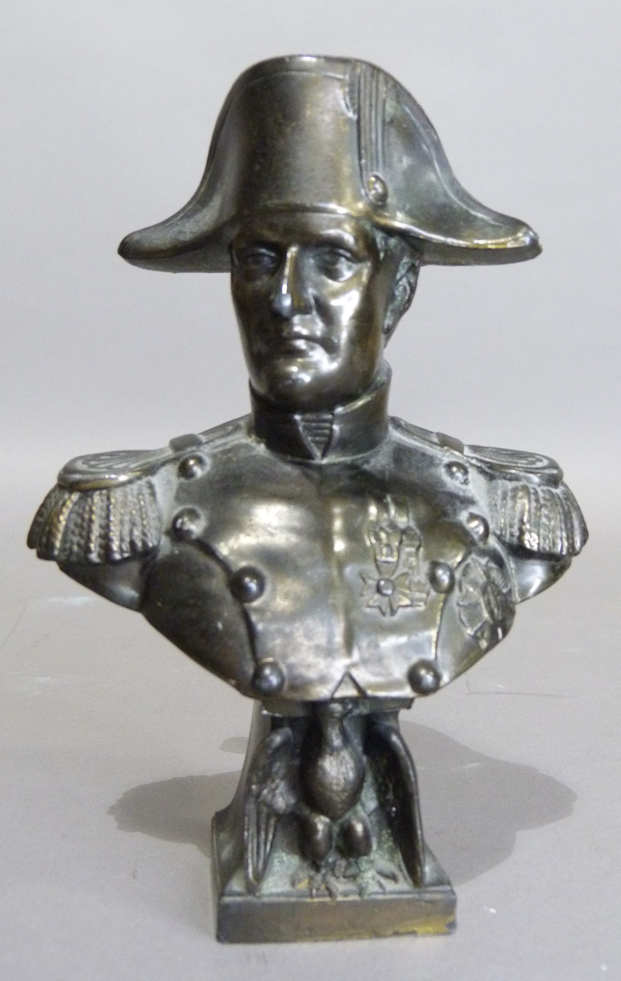 A bronzed bust of Napoleon, the square plinth mounted with an eagle, 16cm high